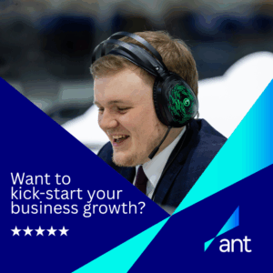 Smiling man in headphones and suit sits at a desk. Text reads: "Want to kick-start your business growth?" with the ant logo and a five-star rating shown.